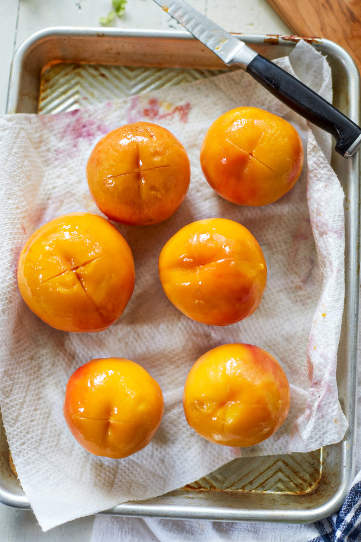 a tray of peeled peaches