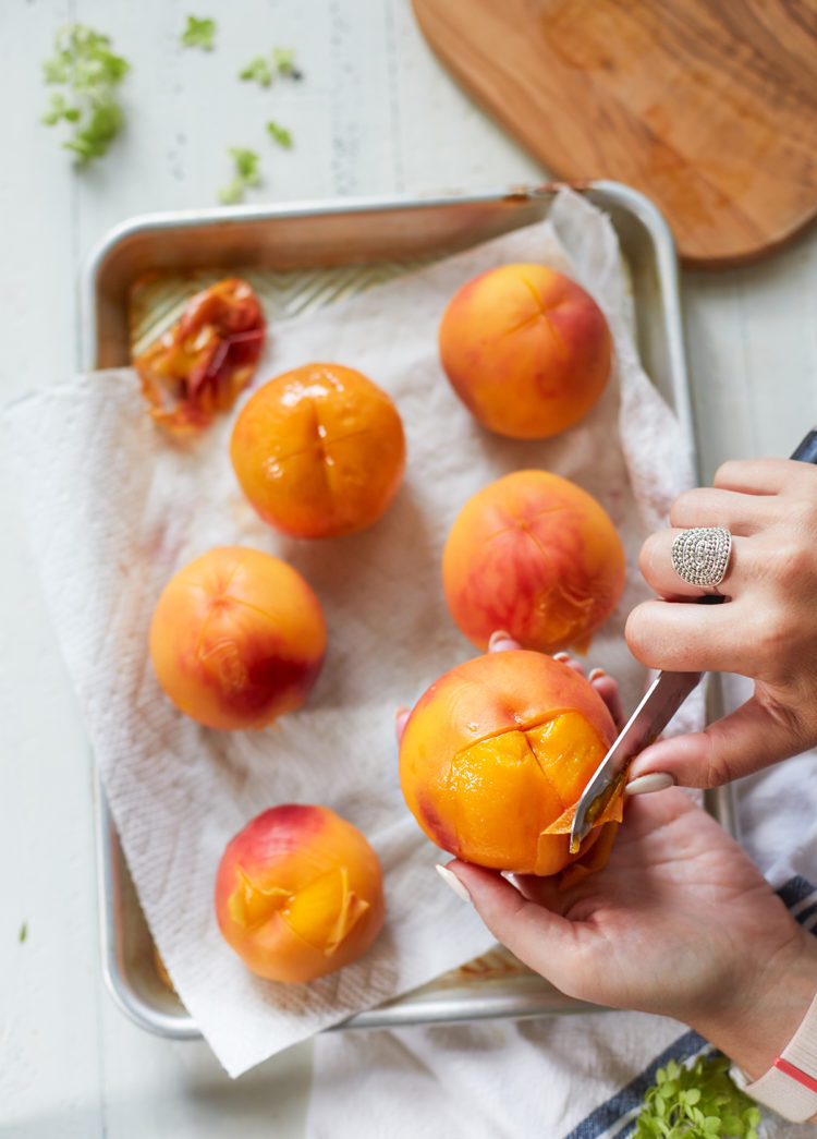 woman peeling a peach