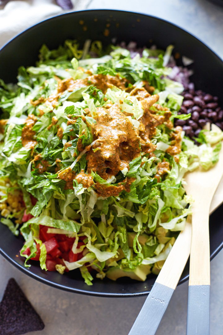 black bean taco salad with dressing in a bowl