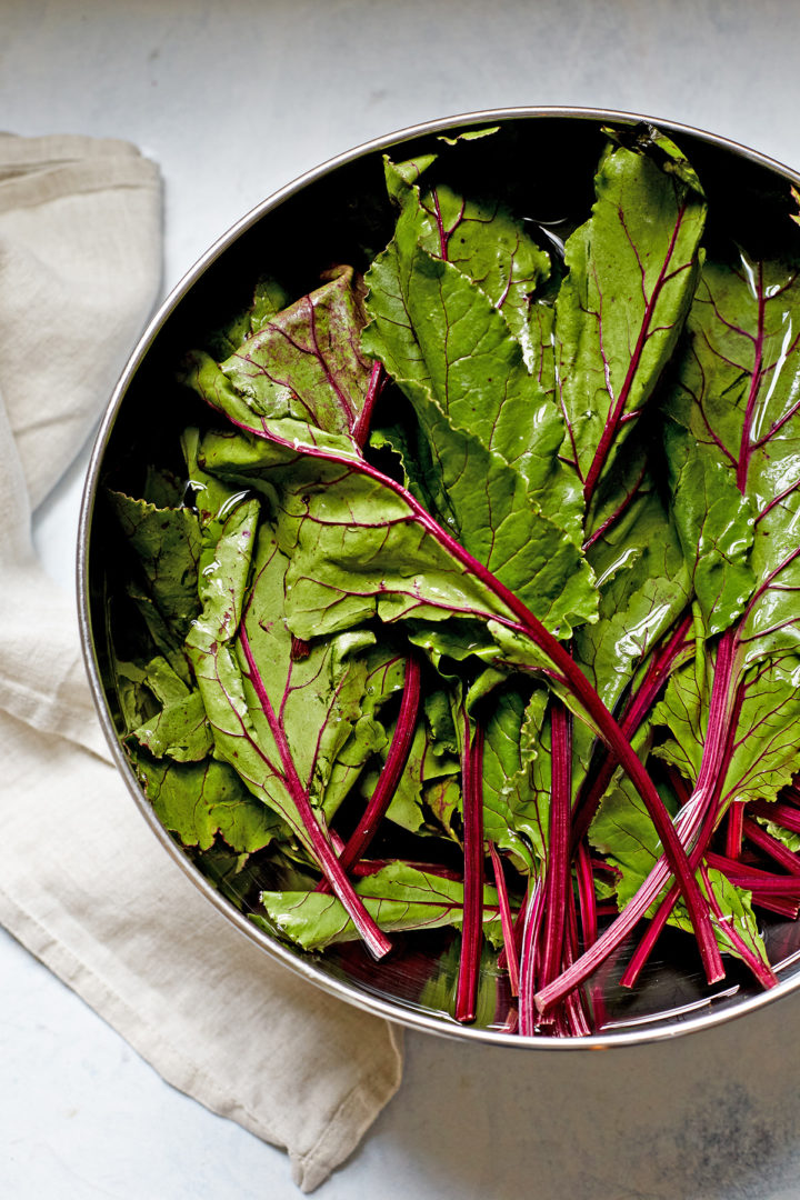 a bowl of fresh beet greens