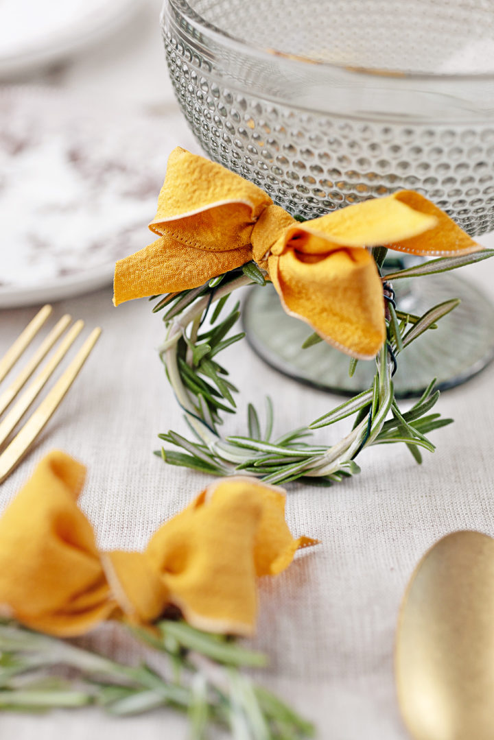 mini rosemary wreath next to a glass dish