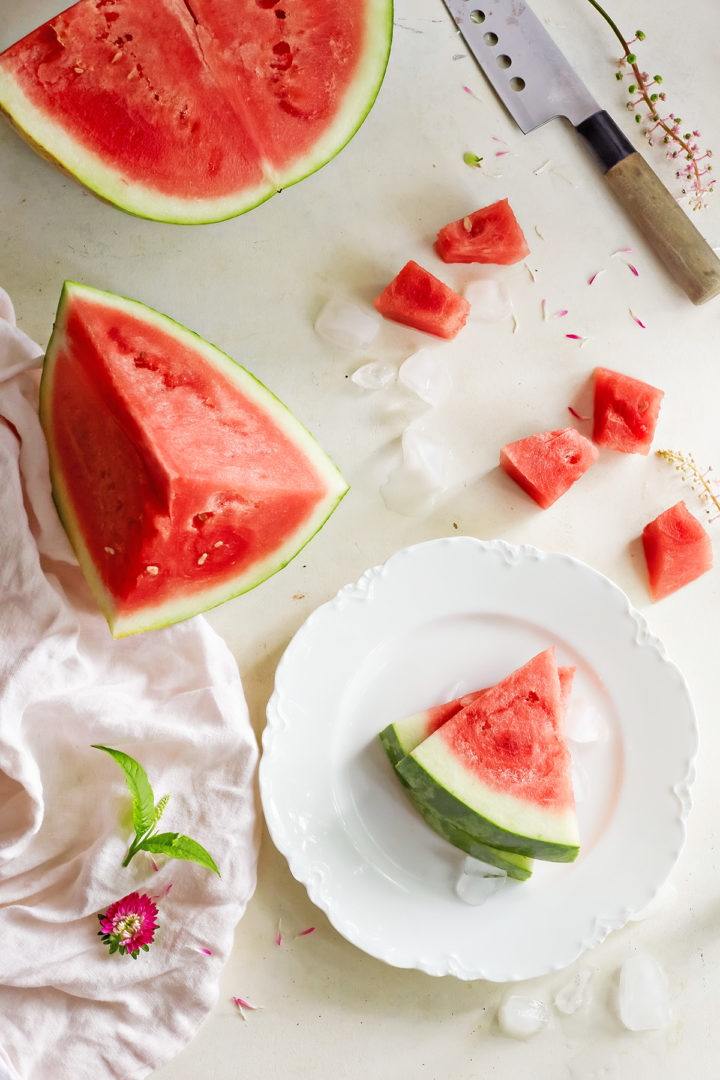 cut up watermelon and a knife