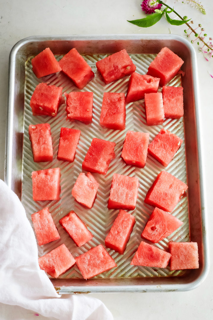 cubes of watermelon on a tray for freezing