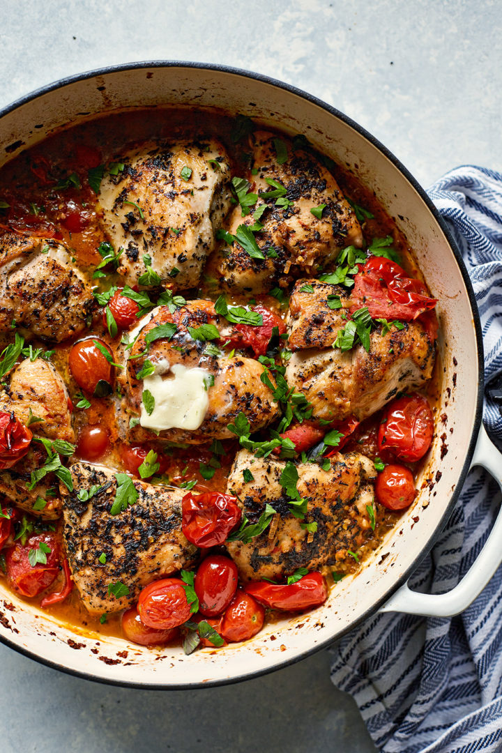 herbs de Provence chicken in a braiser with grape tomatoes