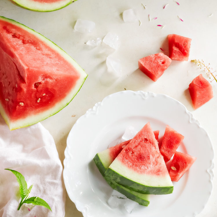 sliced watermelon on a white plate