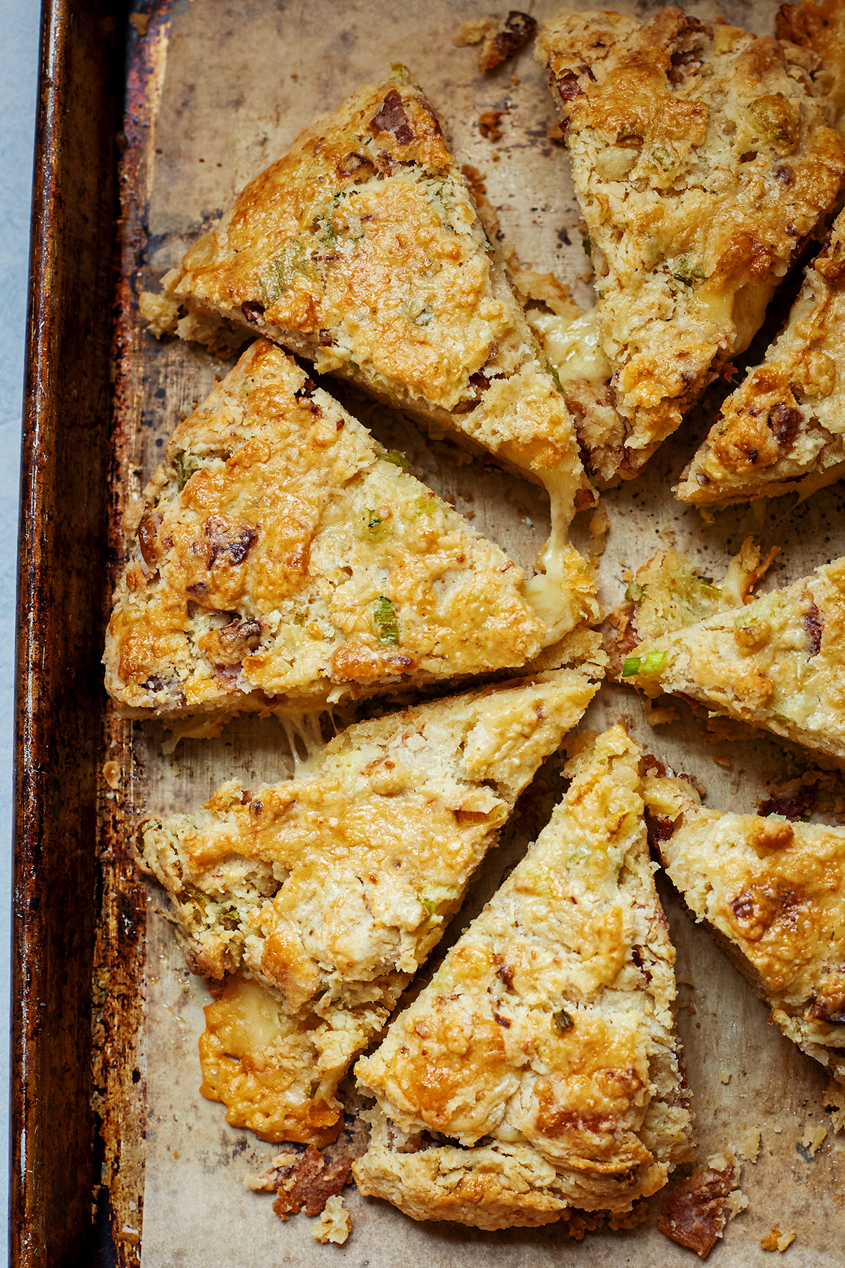 cheese and bacon scones on a baking sheet