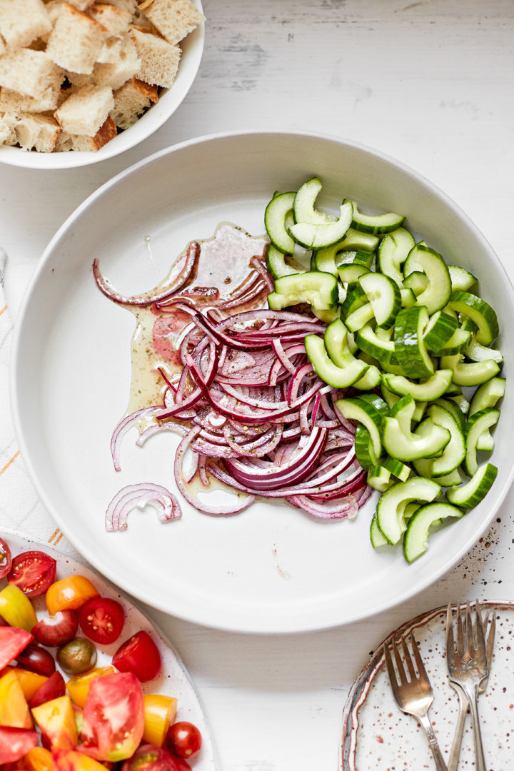 red onions with cucumbers in a bowl