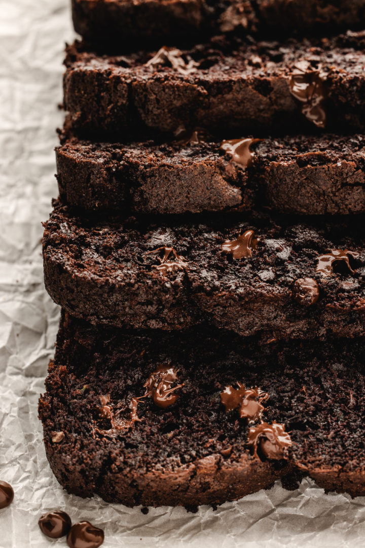 slices of easy chocolate zucchini bread on parchment paper