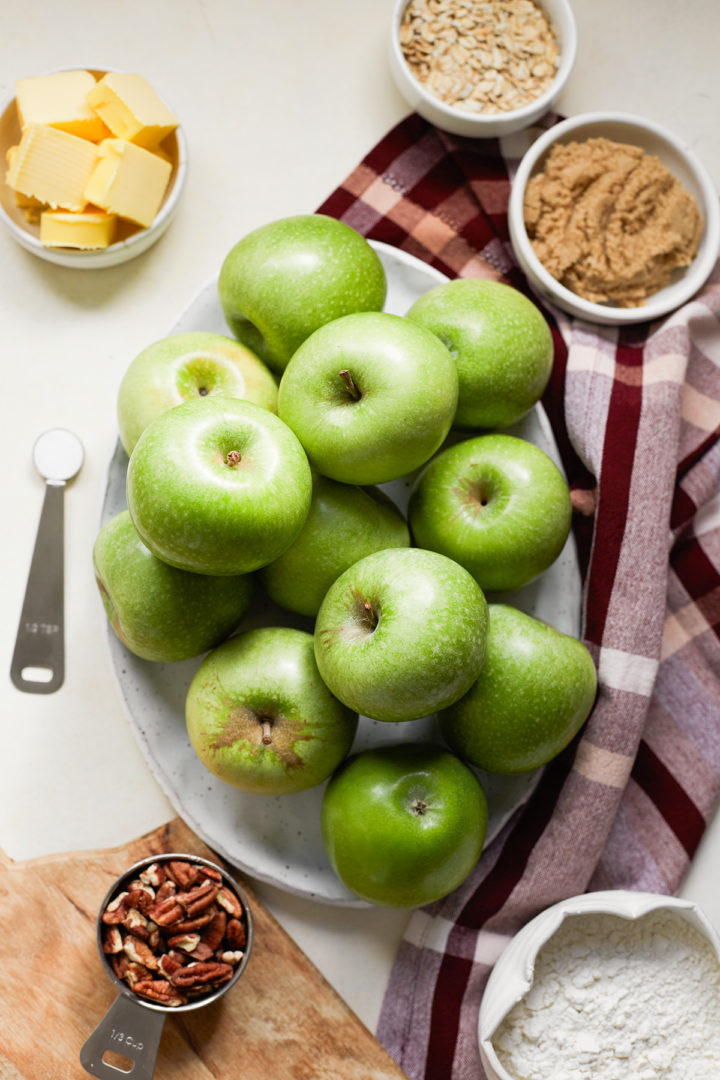 granny smith apples and other ingredients to make a caramel apple crisp