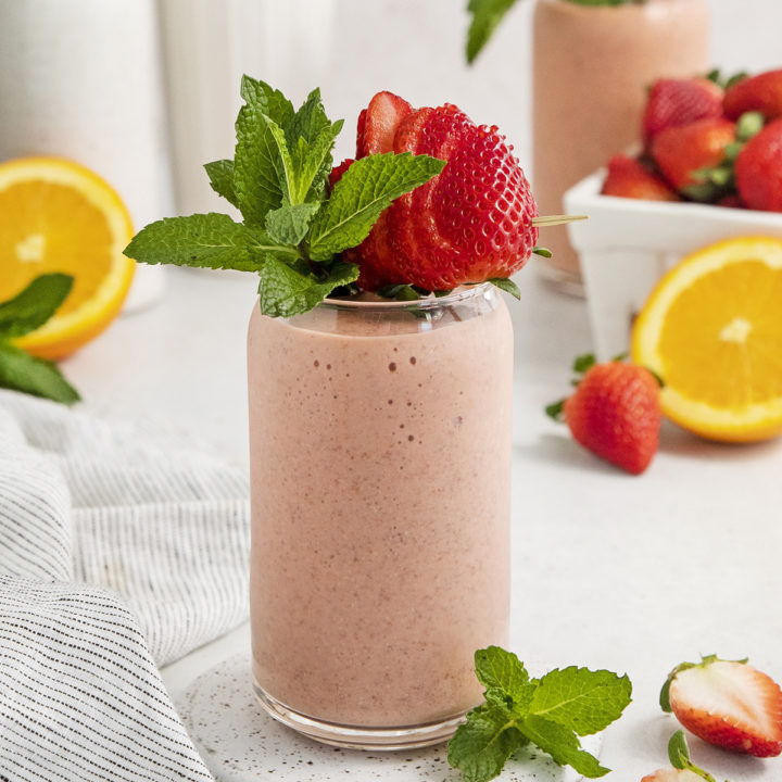 passion fruit smoothie in a glass with fresh mint garnish