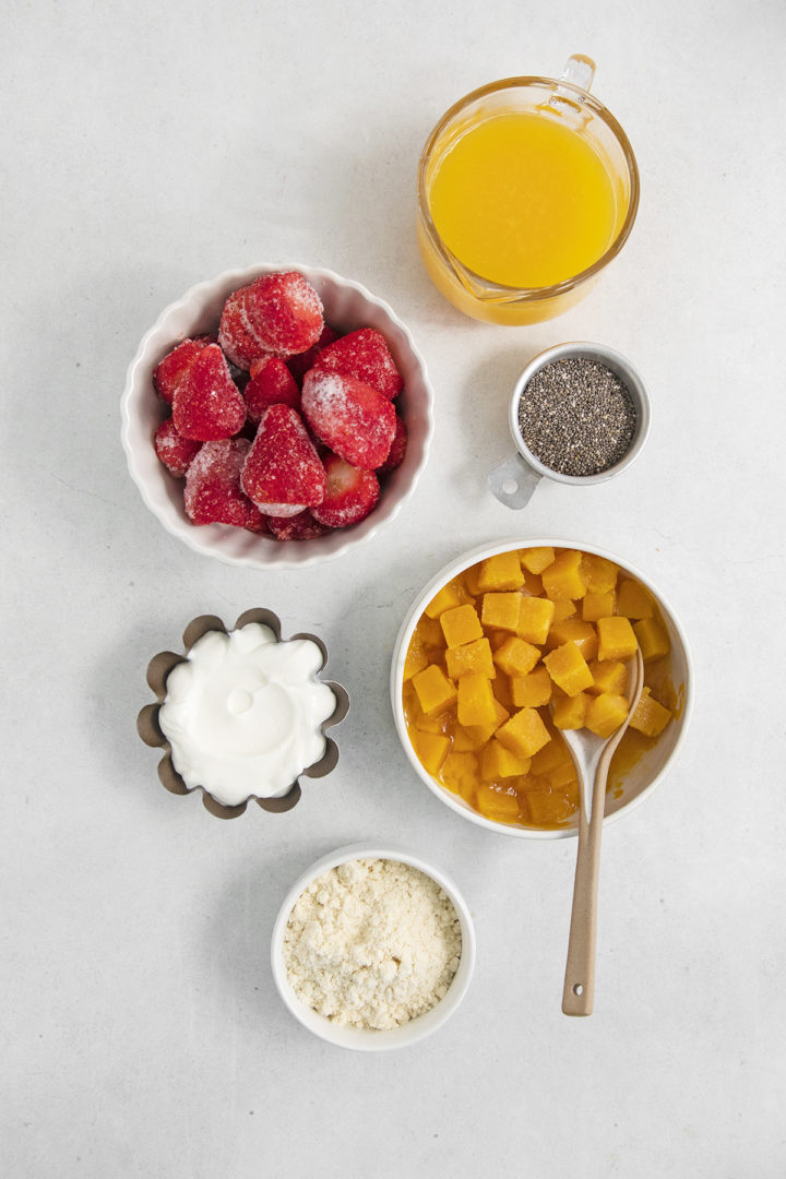 bowls of ingredients needed to make a passion fruit smoothie