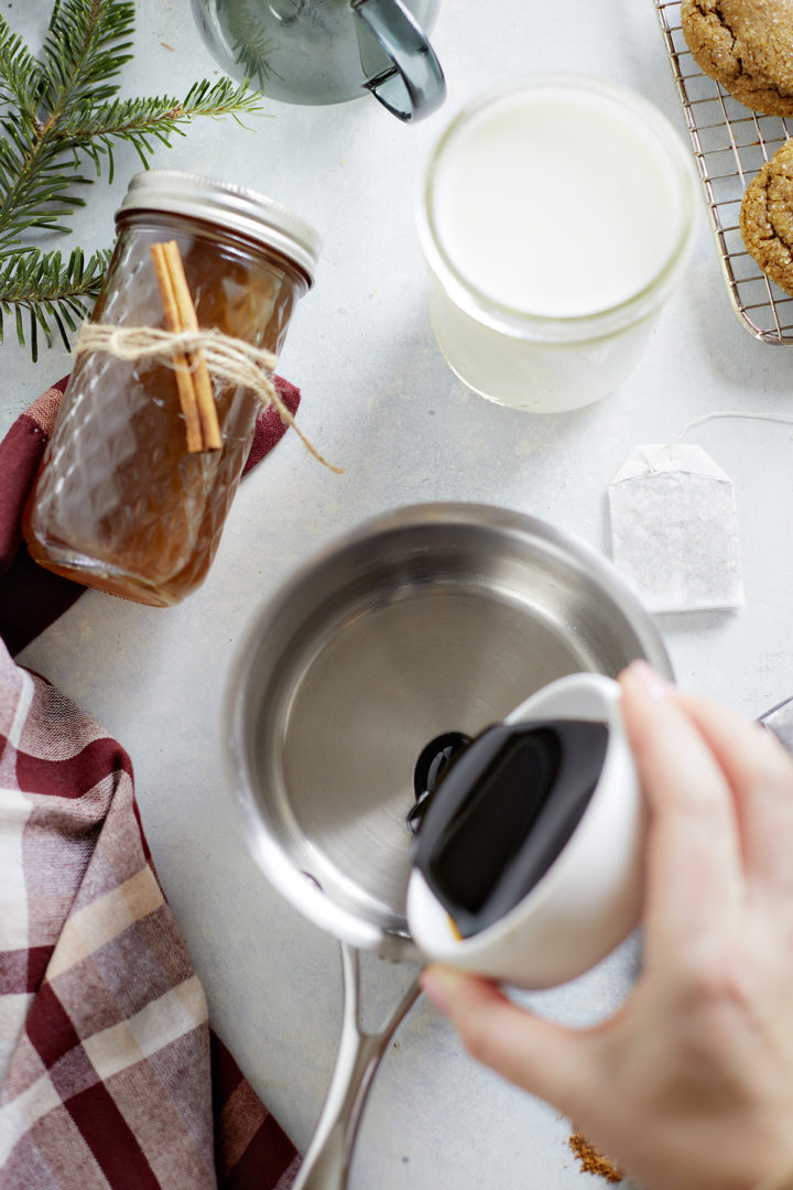 woman making a batch of gingerbread chai