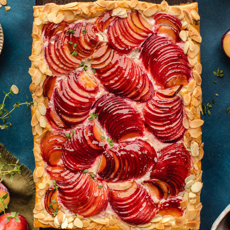 rustic plum tart on a cutting board