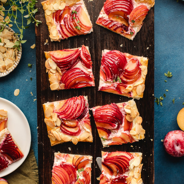 slices of plum tart on a cutting board