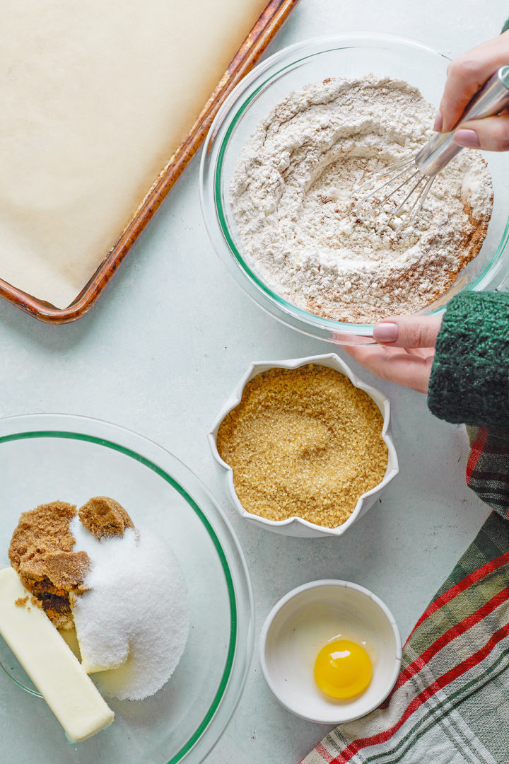 woman making a recipe for gingersnaps cookies