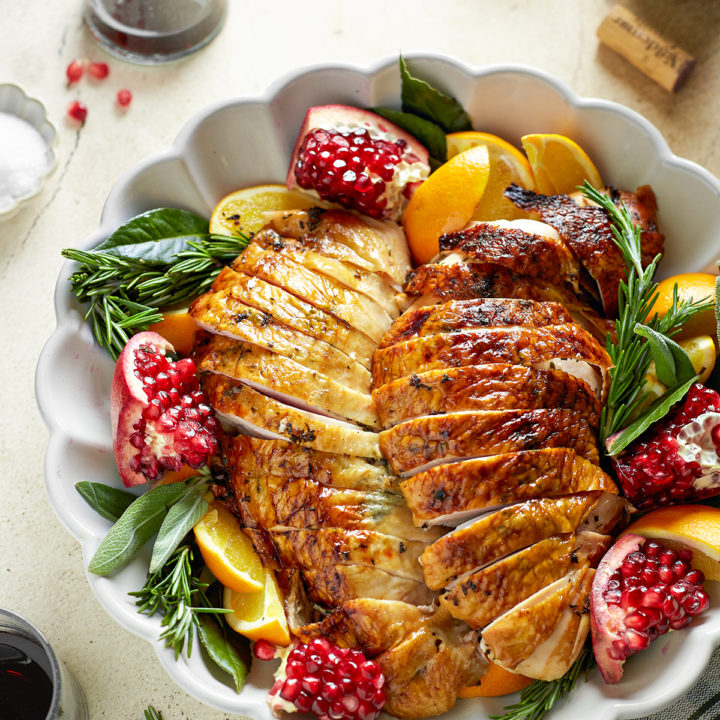 smoked turkey breast on a white platter