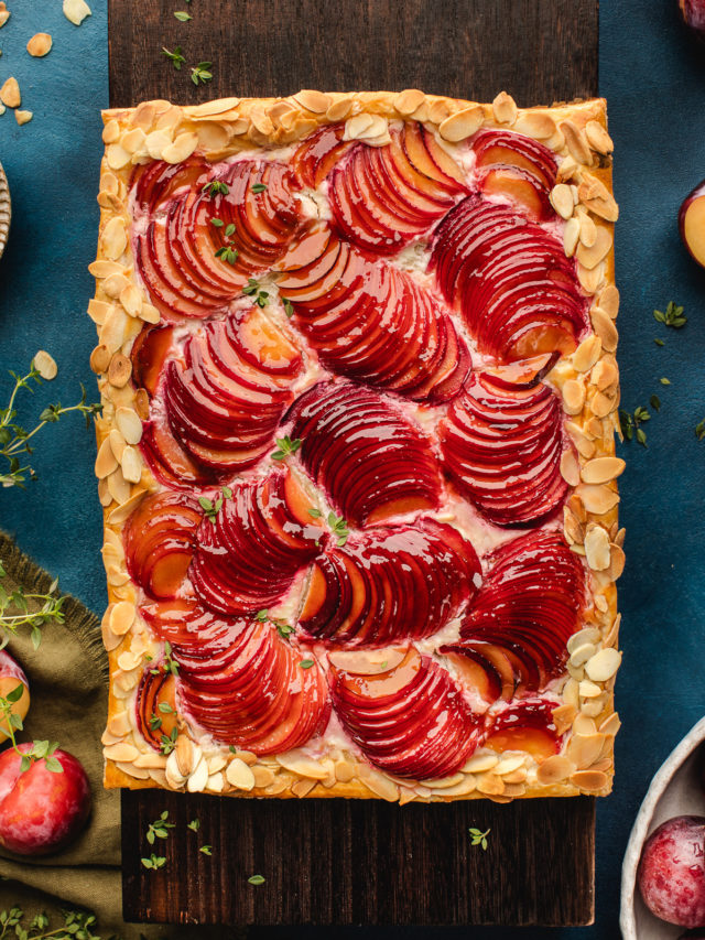 rustic plum tart on a cutting board