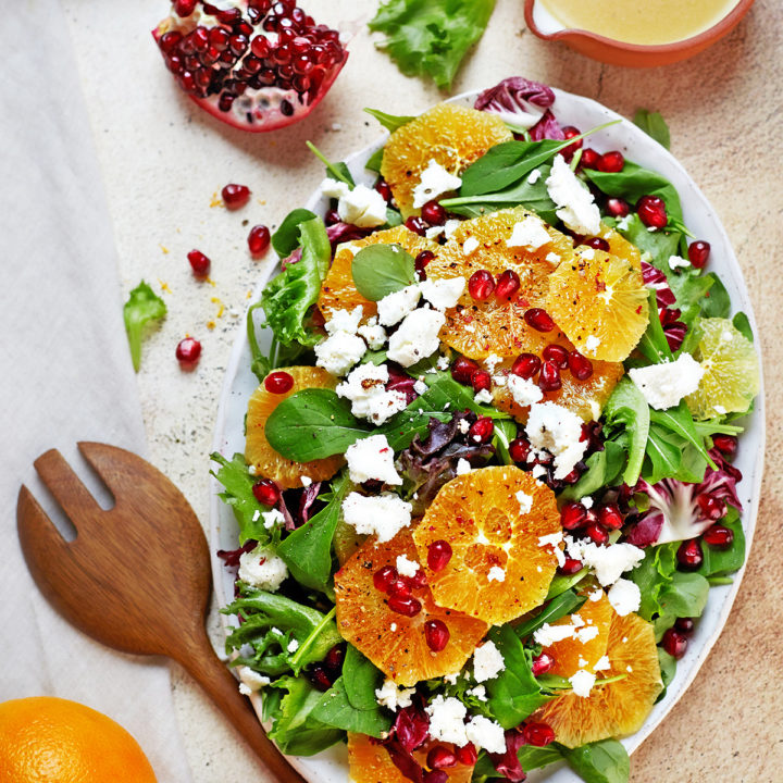 citrus and arugula salad on a platter