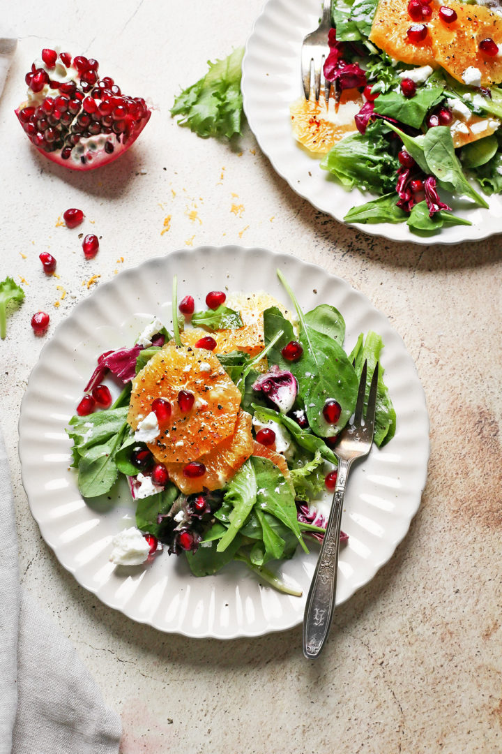 two plates of arugula citrus salad