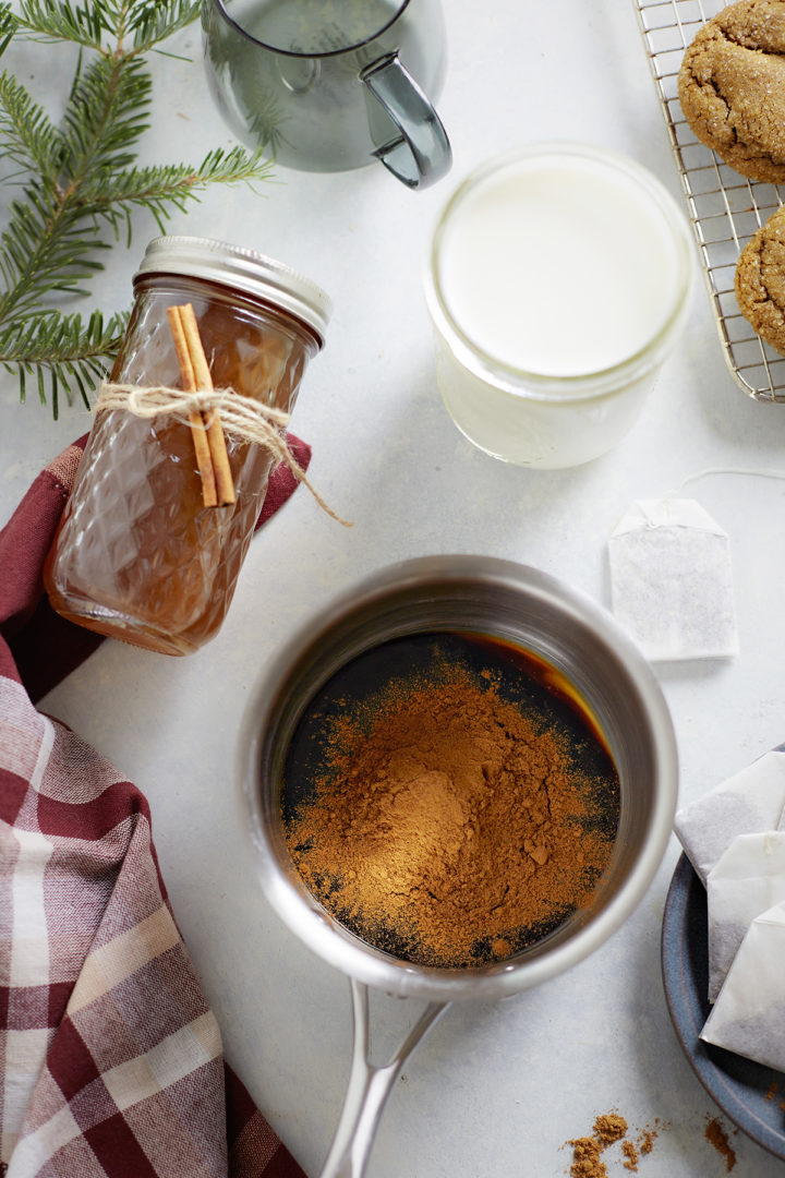 ingredients for gingerbread chai latte in a pot