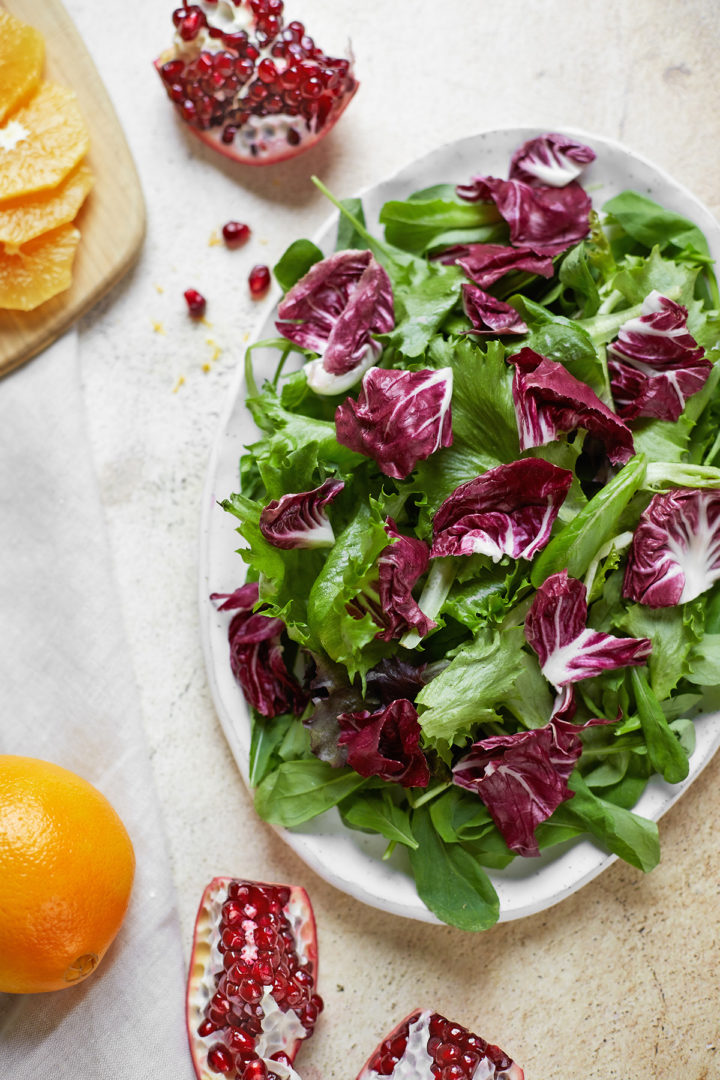 a platter of mixed greens and arugula for citrus salad