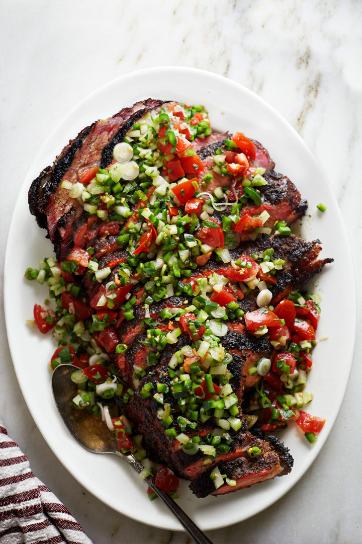 sliced traeger santa maria tri tip on a white platter