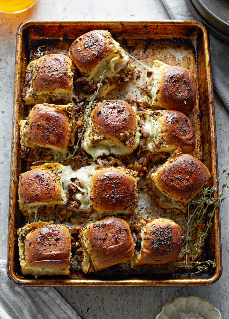 instant pot french dip sliders on a baking sheet