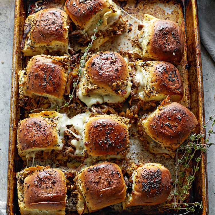 instant pot french dip sliders on a baking sheet