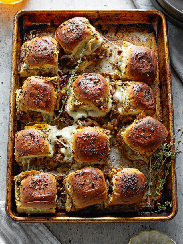 instant pot french dip sliders on a baking sheet